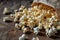 closeup spilled tasty popcorn on wooden rustic background