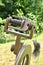 Closeup of spinning wheel and bobbin filled with linen