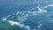 Closeup of splashes and bubbles in blue flowing river, Waimakariri River in New Zealand