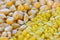 Closeup of split yellow mung beans and sweetcorn seeds