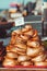 Closeup of stack of fresh smoked fishes at the market over a sea