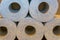 Closeup of a stacked pile of toilet paper, bathroom and household products, sanitary background