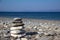Closeup of stacked stones on the coast of the Aegean Sea on a Greek island named Kos