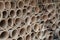 Closeup of stacks of old used weathered terra cotta flower pots in gardening shed