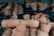 Closeup of stacks of old used weathered terra cotta flower pots in gardening shed