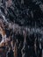 Closeup of stalactites and stalagmites in a cave, vertical shot