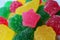 Closeup Star Shaped Fruity Flavor Sugar Coated Jelly Soft Candy on Candies Pile