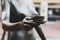 Closeup of a statue of a female holding a cup of coffee