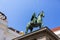 Closeup statue of Holy Roman Emperor Joseph II riding a horse in Josefsplatz Square, Hofburg Palace in Vienna, Austria