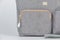 Closeup studio shot of gray color multifunction multipurpose utility zipper newborn baby toddler mommy handbag with milk bottle