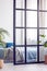 Closeup of stylish bright bedroom interior with wall divider