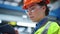 Closeup supervisor working manufacturing company in safety uniform. Tech concept