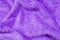 Closeup surface fabric pattern at old and wrinkled purple fabric towel texture background