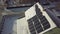 Closeup surface on a house roof covered with solar panels in winter with snow on top.