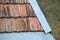 Closeup surface of old weathered ceramic tiles covering building roof