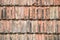 Closeup surface of old weathered ceramic tiles covering building roof