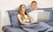 Closeup Surprised emotional white Lover or couple when using technology laptop on the bed in bed room at modern home, couple