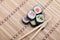 Closeup sushi and chopsticks on bamboo mat