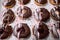 Closeup of sweet and delicious donuts ready for transport to pastry store. Pastry, dessert, sweet