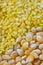 Closeup of sweetcorn seeds and split yellow mung beans