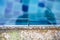 Closeup swimming pool damage by acid water eating out grouting