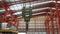 Closeup of swivel chain hook crane of electric hoist in factory workshop