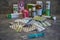 Closeup of a syringe and various pills in the background. Vaccine in a syringe. Collection of various pills and drugs