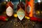 Closeup of Tabasco hot chipotle pepper sauce on wood table with peppercorns and chillis