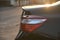 Closeup tail light of black modern car in the morning