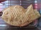 Closeup of taiyaki, fish-shaped cake, just fresh out of oven