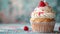 Closeup of tasty cupcake with colorful sprinkles and berries