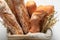 Closeup of tasty golden baguettes with grains and ears