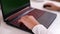 Closeup of teenage boy playing game on his pc computer in white room. Gamer capture video on web camera on laptop. Focus