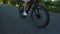 Closeup teenage girl cycling on bicycle outdoors