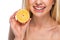 Closeup on teenage girl holding lemon