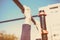 Closeup of a teenager`s hands on a horizontal bar. Pulling on the crossbar. Vintage toning