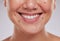 Closeup, teeth and woman with dental care, cosmetics and treatment against grey studio background. Zoom, female and lady