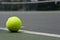 Closeup of tennis ball on base line