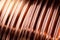 Closeup texture copper cable rolled coil up on industry factory