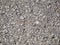 Closeup texture of crushed stone and sand mixture ground