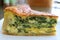 Closeup the Texture of a Slice of Homemade Spinach Quiche