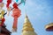 Closeup Thai Lanna style lanterns to hang in front of the golden pagoda at Thai temple