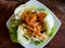 Closeup Thai spicy Fried shrimp salad on table