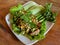 Closeup Thai spicy minced pork salad on table