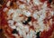 Closeup of thin crust New York style margarita pizza