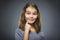 Closeup Thoughtful girl with Hand at head isolated on Gray