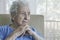 Closeup of a thoughtful senior woman at home