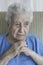 Closeup of a thoughtful senior woman at home