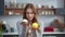 Closeup thoughtful woman looking at creamy dessert and fresh apple in kitchen