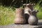 Closeup of three unique handmade vases of ceramic in summer sunlight